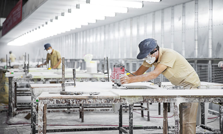 worker is polishing the surface of solid surface sheet